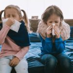 sick children sneezing tissues blow nose