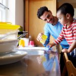 dad teaches son to wash dishings gender gap closure
