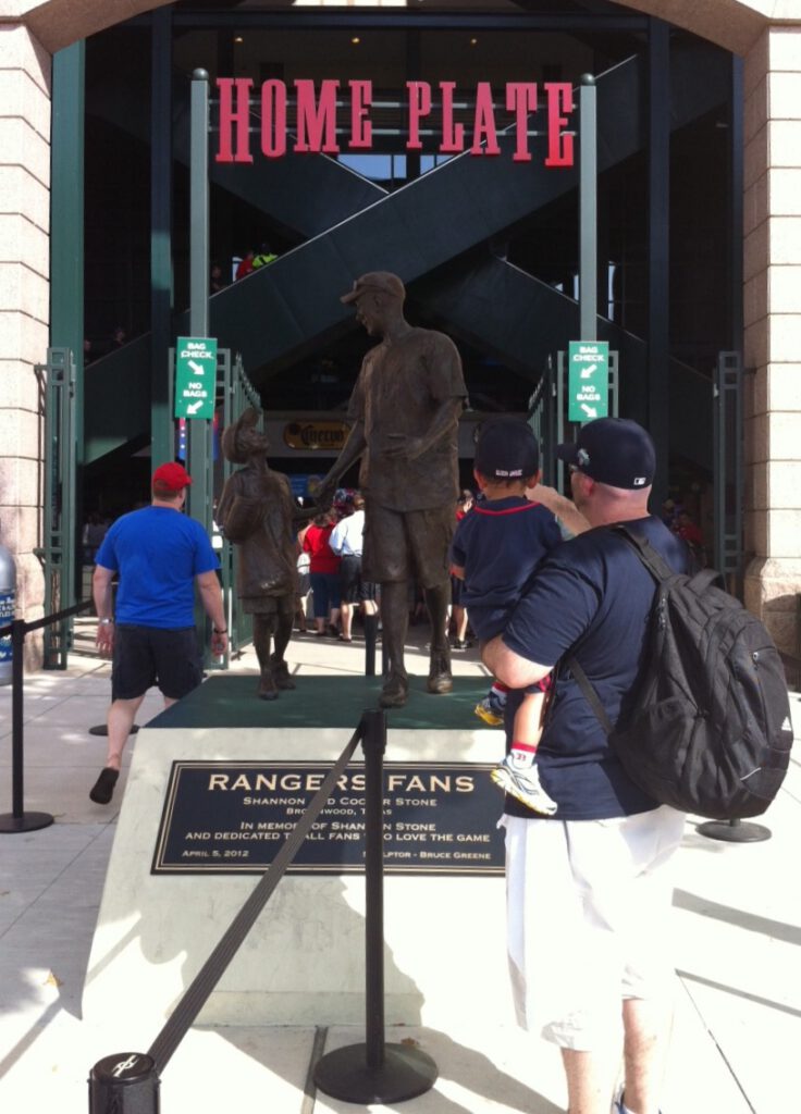 Baseball fans with the statue of Shannon Stone and Cooper Stone at Globe Live Park