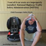 dad struggling with car seat