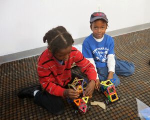 kids play with magformers