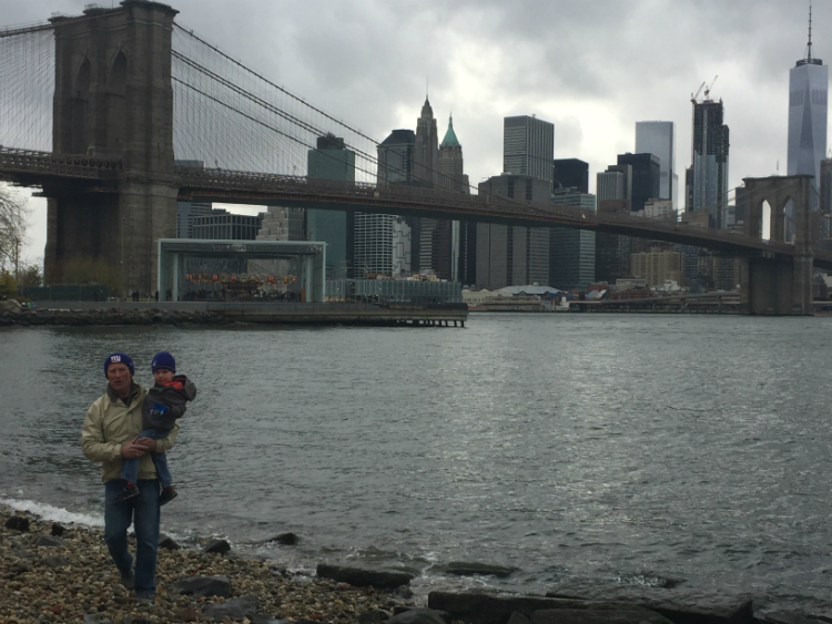 My father carries my son by the Brooklyn Bridge