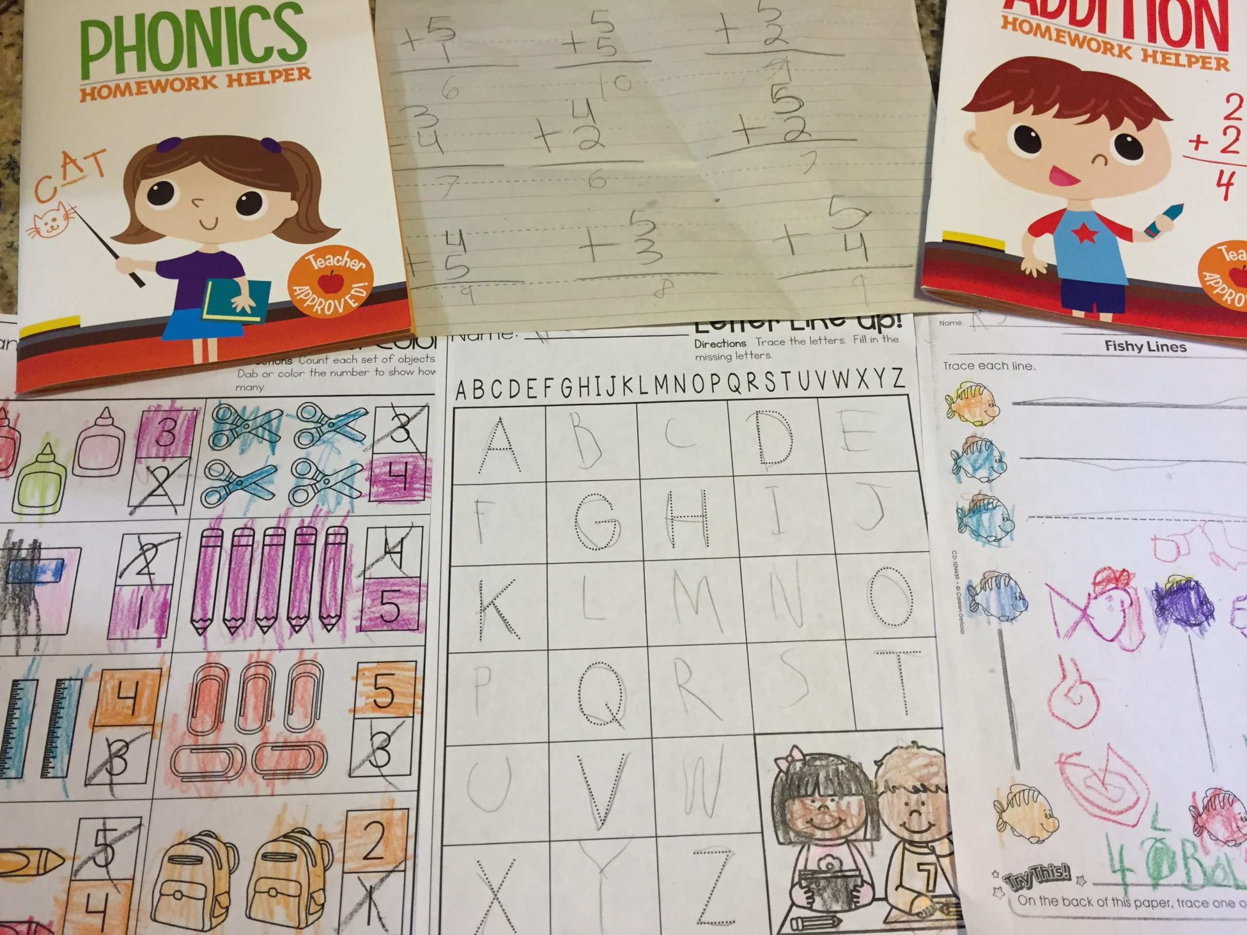 A collection of schoolwork by a small child.