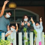 asian family in masks covid quarantine