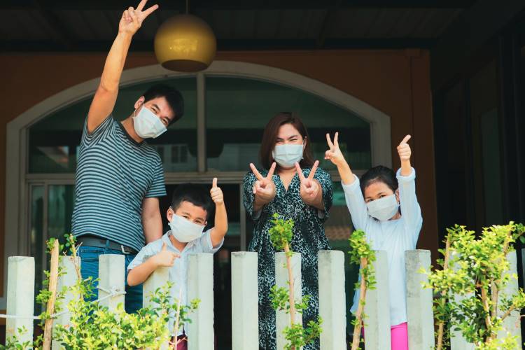 asian family in masks covid quarantine