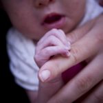 baby holding hand