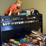 boys in bunk bed talking in bedroom
