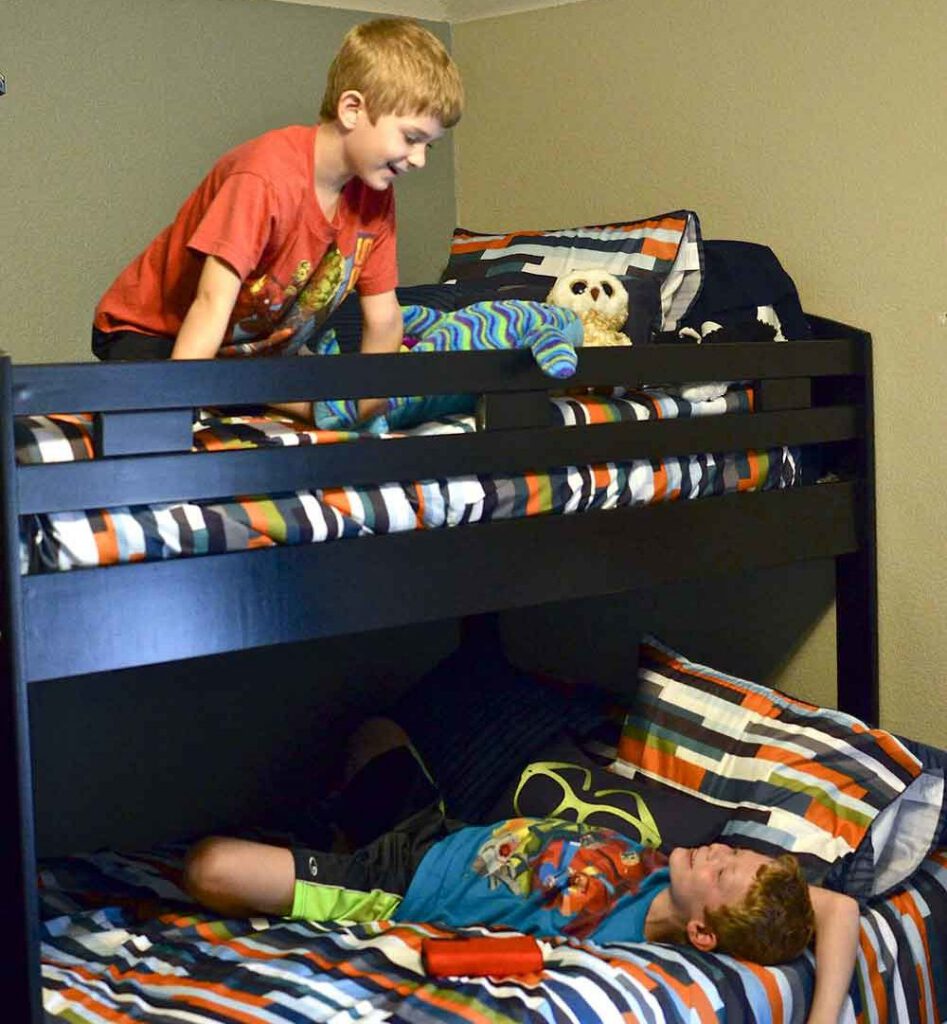 boys in bunk bed talking in bedroom