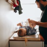 dad changing diapers