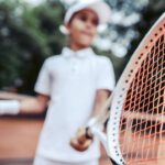 child playing tennis racket