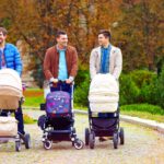 dads babysitting the kids strollers park 1