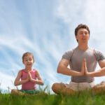 meditation yoga man child grass 1