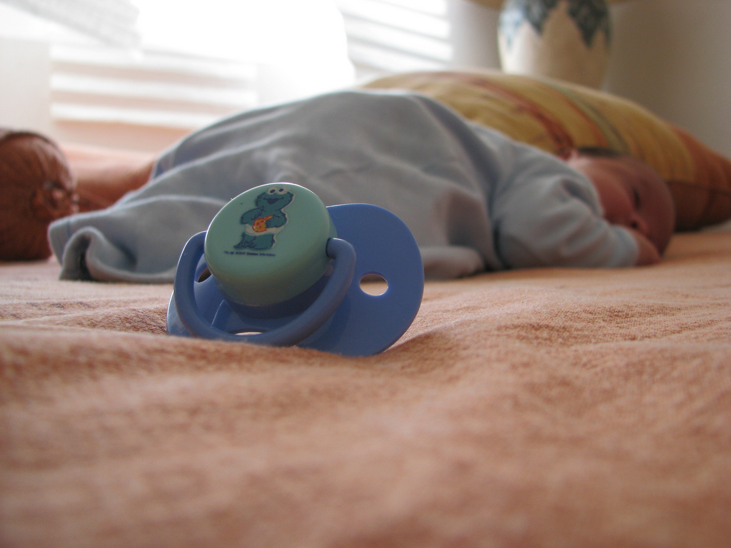pacifier next to sleeping baby