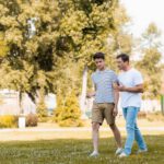 parent teen communication father son walk talk in park 1
