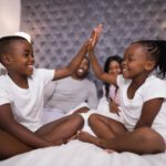 parenting siblings black brother sister high five