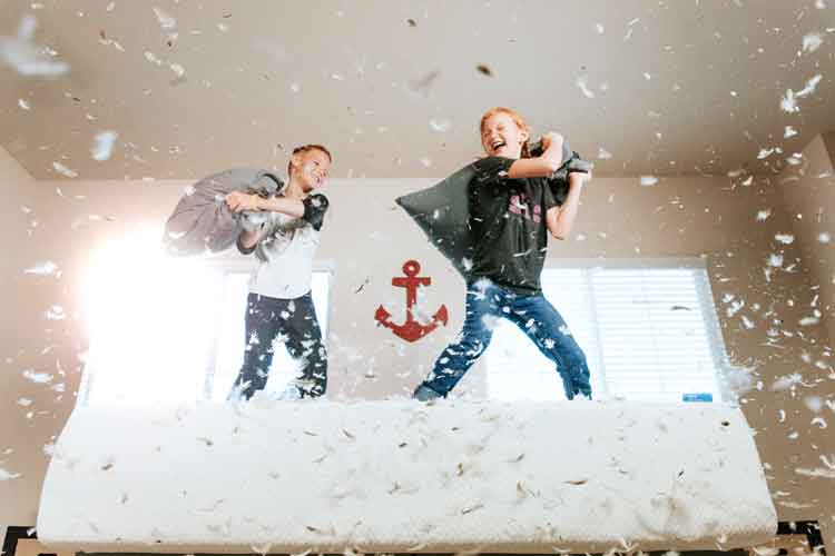 pillow fight on bed special moments