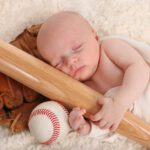 sleeping baby baseball bat glove