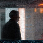 man standing in rain