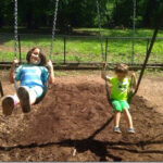 Joseph E. DeVoy Playground in Forest Park kids on swings
